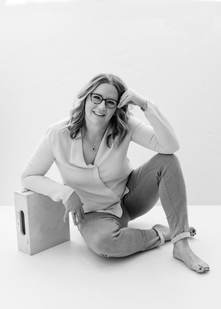 Woman in tech sitting in a white room. Darina Neyret Portrait. PDX Photographer.